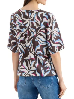 Blouse chocolat à motifs pourvue de manches courtes et d'un col tunisien