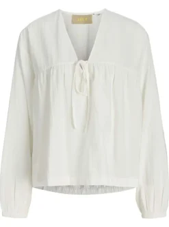 Blouse en coton biologique blanche pourvue d'un col v et de manches longues