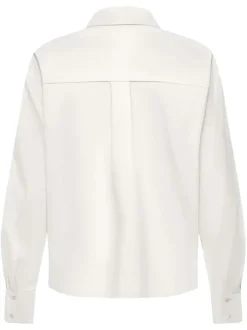 Blouse en coton blanche unie avec un col français et une fermeture boutonnée