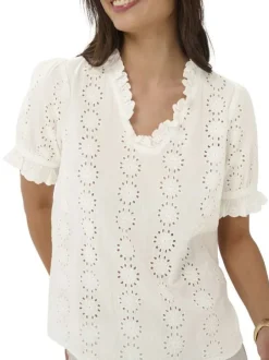 Blouse en coton blanche unie pourvue d'une coupe droite et d'un col v