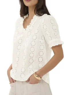 Blouse en coton blanche unie pourvue d'une coupe droite et d'un col v