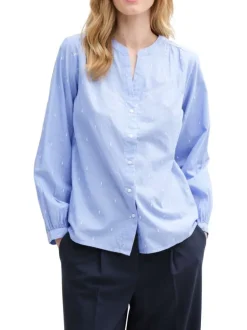 Blouse en coton bleue à pois avec une coupe ample et un col v