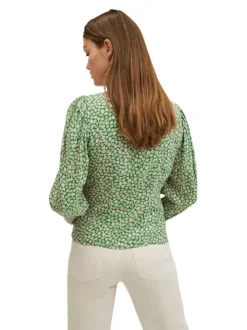 Blouse fluide verte à imprimé floral blanc avec manches longues bouffantes et col v