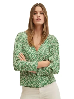 Blouse fluide verte à imprimé floral blanc avec manches longues bouffantes et col v