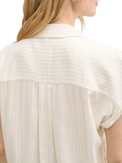 Blouse manches courtes beige rayée avec col v profond et une coupe loose fit