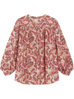 Blouse rose à motifs pourvue d'un col rond et de manches longues