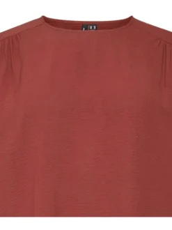 Blouse rouge brique unie dos nu avec une coupe droite un col ras du cou