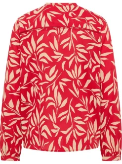 Blouse rouge ornée d'un motif fantaisie avec un col tunisien