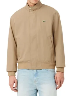 Blouson beige à coupe ajustée pourvu d'un col à boutons pression