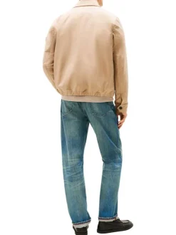Blouson beige à coupe ajustée pourvu d'un col à revers et de manches longues