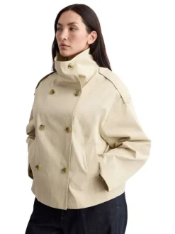 Blouson beige uni avec une coupe cropped et un col montant boutonné