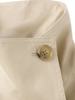 Blouson beige uni avec une coupe cropped et un col montant boutonné