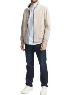 Blouson beige uni avec une coupe droite et deux poches raglan à l’avant