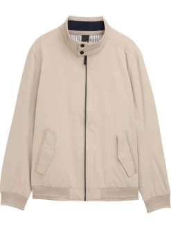 Blouson beige uni avec une coupe droite et deux poches raglan à l’avant