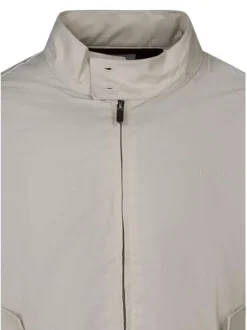 Blouson beige uni avec une coupe droite et un col montant boutonné