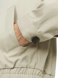 Blouson beige uni coupe droite avec un col français et bouton au col