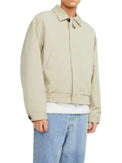 Blouson beige uni coupe droite avec un col français et bouton au col