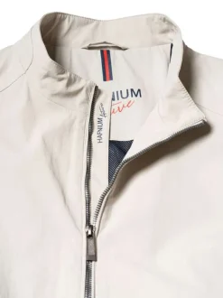 Blouson beige uni pourvu d'une coupe droite et d'un col montant