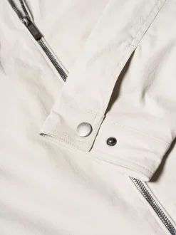 Blouson beige uni pourvu d'une coupe droite et d'un col montant