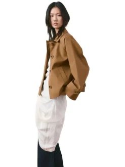 Blouson brun uni pourvu d'une coupe oversize et d'un col chemise
