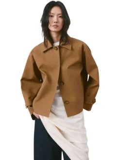 Blouson brun uni pourvu d'une coupe oversize et d'un col chemise