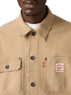 Blouson en coton beige uni avec un patch de la marque sur la poitrine