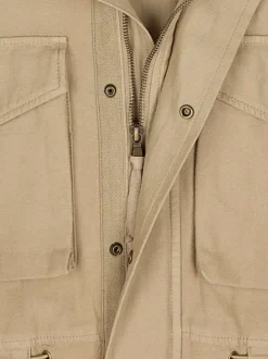 Blouson en coton beige uni à coupe ample avec un col montant