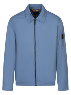 Blouson en coton bleu uni avec une coupe droite et un col à revers