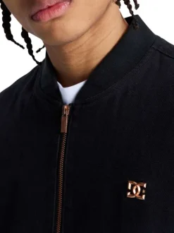 Blouson en coton noir uni sans manche avec une coupe droite