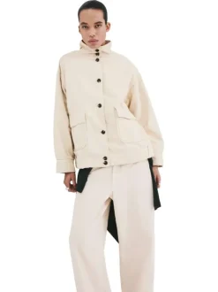 Blouson en lin écru uni pourvu d'une coupe droite et d'un col montant