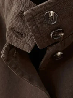 Blouson en lin marron uni pourvu d'une coupe oversize et d'un col montant