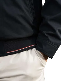 Blouson en nylon bleu marine uni zippé avec un col montant et des poches