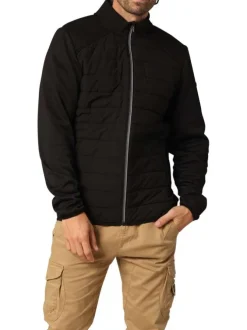 Blouson marine avec un col montant zippé et logo de la marque sur une manche