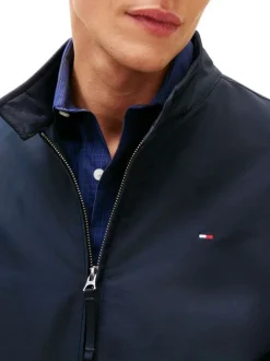 Blouson marine à coupe ajustée pourvu d'un col boutonné et de manches longues
