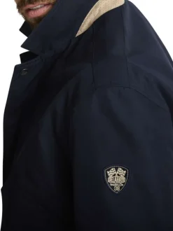 Blouson marine uni avec une coupe ajustée, un zip et des boutons-pressions