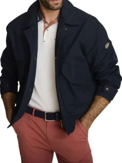 Blouson marine uni avec une coupe ajustée, un zip et des boutons-pressions