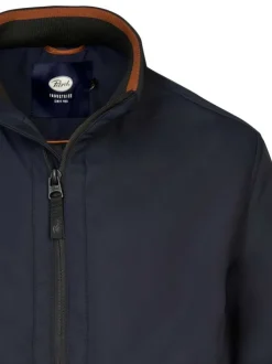 Blouson marine uni avec une coupe droite, col montant et fermeture zippée