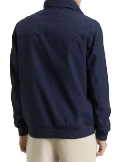 Blouson marine uni avec une coupe droite et des poches zippées à l’avant