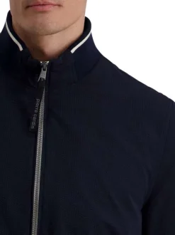 Blouson marine uni avec une coupe droite et une fermeture zippée