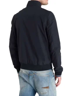 Blouson marine uni fermé par un zip à l'avant avec un col montant