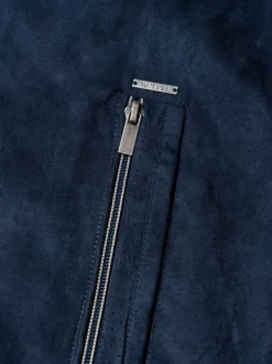 Blouson marine uni pourvu d'une coupe droite et d'un col montant