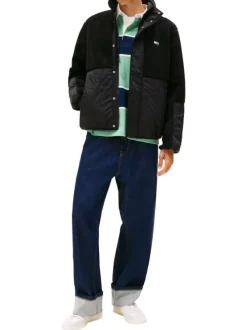 Blouson noir uni avec une coupe droite et une fermeture zippée
