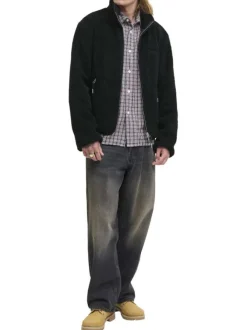 Blouson noir uni en sherpa avec une coupe droite et un col montant