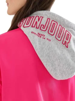 Blouson rose uni pourvu d'une coupe droite et d'une capuche détachable