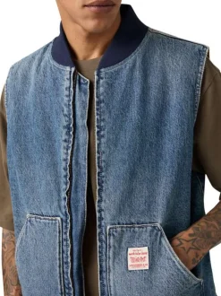 Blouson sans manche en coton bleu à coupe droite pourvu d'un col bomber