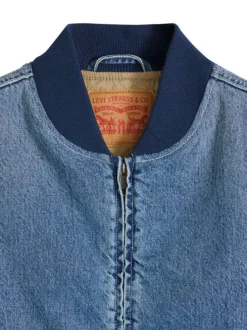 Blouson sans manche en coton bleu à coupe droite pourvu d'un col bomber