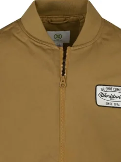 Blouson sans manches bronze uni avec une coupe droite et un col bomber