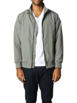 Blouson vert sauge uni à coupe droite et à col montant avec des poches zippées