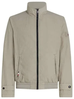Blouson zippé beige uni avec une coupe droite et un col montant