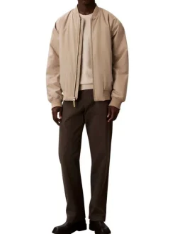Bomber beige à coupe ajustée pourvu d'une fermeture zippée argentée